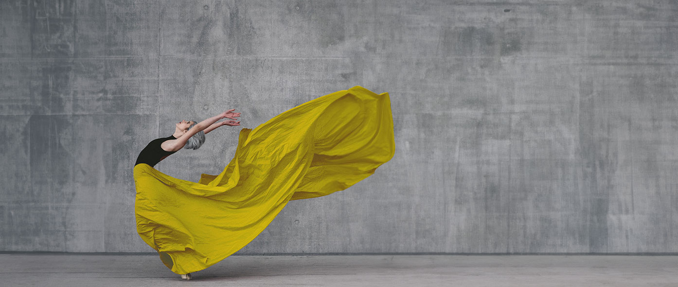 A woman holding a yellow seal around her